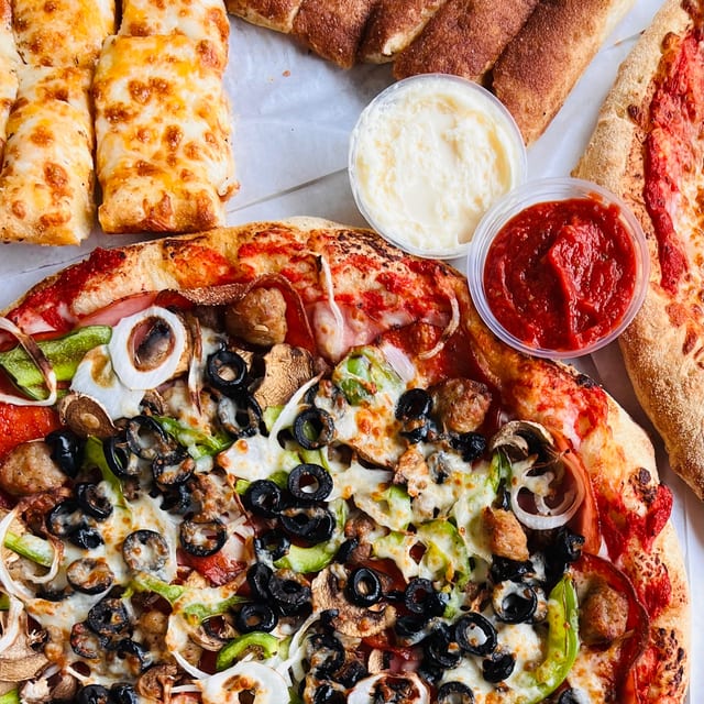 55.99 Medium Specialty Pizza, Large-2 Topping Pizza, Bread and 2 Liter Soda.